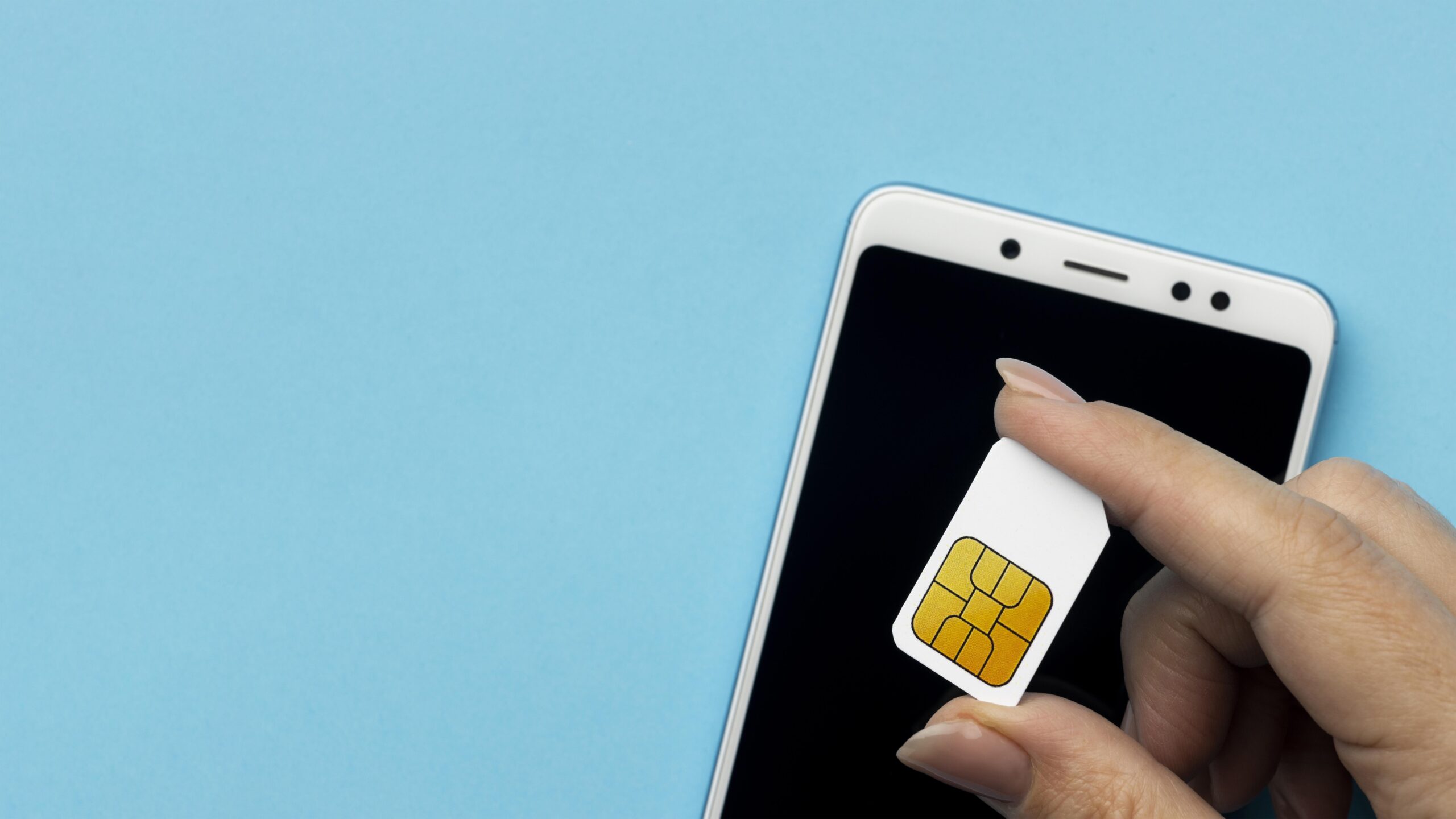 View Sim Card top-view-hand-holding-sim-card-with-smartphone-copy-space-1 ...